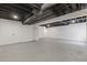 Unfinished basement featuring concrete floors and exposed ductwork, perfect for customization at 565 Deer Sw Run, Lilburn, GA 30047