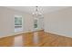 Light and airy dining room with hardwood floors and ample natural light at 565 Deer Sw Run, Lilburn, GA 30047