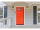 Close up of the bright red front door with decorative glass at 565 Deer Sw Run, Lilburn, GA 30047
