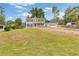 Charming two-story home with a bright red front door and covered porch at 565 Deer Sw Run, Lilburn, GA 30047