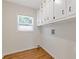 Functional laundry room with ample storage space and natural light at 565 Deer Sw Run, Lilburn, GA 30047