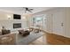 Bright living room with hardwood floors, fireplace, and stylish decor at 565 Deer Sw Run, Lilburn, GA 30047