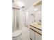 Bathroom with tile flooring, toilet, vanity, and a shower with a white curtain at 922 Barton Woods Ne Rd, Atlanta, GA 30307