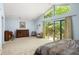 Spacious bedroom with a sitting area, deck access, and expansive windows providing ample natural light at 922 Barton Woods Ne Rd, Atlanta, GA 30307
