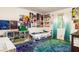 Unique bedroom with vibrant decor, carpet, and custom wall art creating a personalized space at 922 Barton Woods Ne Rd, Atlanta, GA 30307