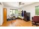 Cozy bedroom with hardwood flooring, ceiling fan, bunk bed, and dresser with storage drawers at 922 Barton Woods Ne Rd, Atlanta, GA 30307