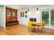 Inviting dining area adjacent to a fireplace and featuring unique yellow retro furniture at 922 Barton Woods Ne Rd, Atlanta, GA 30307