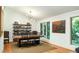 This dining room features a sleek table, modern lighting, and hardwood floors at 922 Barton Woods Ne Rd, Atlanta, GA 30307