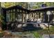 View of the outdoor deck area with black painted stairs leading to the backyard at 922 Barton Woods Ne Rd, Atlanta, GA 30307