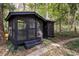 Exterior screened-in room with black siding and door at 922 Barton Woods Ne Rd, Atlanta, GA 30307