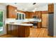 Charming kitchen with wood cabinets, stainless steel appliances, and peninsula with white countertop at 922 Barton Woods Ne Rd, Atlanta, GA 30307