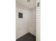 Tiled shower featuring black honeycomb floor, white subway tile walls, built in seat and storage niche at 922 Barton Woods Ne Rd, Atlanta, GA 30307