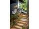 Exterior stone steps leading up to a modern home surrounded by lush greenery and mature trees at 922 Barton Woods Ne Rd, Atlanta, GA 30307