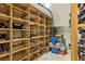 Wine cellar with wooden racking system, showcasing storage for an extensive wine collection and ample storage at 922 Barton Woods Ne Rd, Atlanta, GA 30307