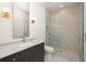 Elegant bathroom featuring a glass-enclosed shower and modern vanity with stylish fixtures at 11554 Serenbe Ln, Chattahoochee Hills, GA 30268