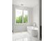 Bright bathroom with a soaking tub and a window offering natural light, complemented by marble floors at 11554 Serenbe Ln, Chattahoochee Hills, GA 30268