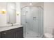 Modern bathroom with mosaic-tiled shower, elegant vanity, and framed mirror offering a luxurious feel at 11554 Serenbe Ln, Chattahoochee Hills, GA 30268