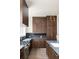 Gourmet kitchen with stainless appliances, stone countertops, and custom cabinetry at 11554 Serenbe Ln, Chattahoochee Hills, GA 30268
