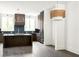 Modern kitchen featuring custom island with wood cabinets and stylish lighting at 11554 Serenbe Ln, Chattahoochee Hills, GA 30268
