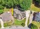 Overhead view of the property showing the house layout, long driveways, and landscaping at 2645 Preston Ridge Ln, Dacula, GA 30019