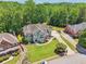 Aerial view of home featuring a well-manicured lawn, mature trees, and a circular driveway at 2645 Preston Ridge Ln, Dacula, GA 30019