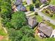 Aerial view of the property surrounded by mature trees and a well-maintained neighborhood at 2645 Preston Ridge Ln, Dacula, GA 30019