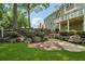 Beautiful backyard features stonework and a lush green lawn at 2645 Preston Ridge Ln, Dacula, GA 30019