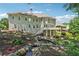 Stunning backyard featuring a deck, flowing water feature, and professional landscaping at 2645 Preston Ridge Ln, Dacula, GA 30019