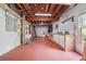 Spacious unfinished basement with exposed wooden beams and painted concrete floor at 2645 Preston Ridge Ln, Dacula, GA 30019