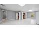 Bright finished basement with tile floors and multiple doorway access points at 2645 Preston Ridge Ln, Dacula, GA 30019
