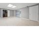 Finished basement with tile flooring, utility closet, and bonus room at 2645 Preston Ridge Ln, Dacula, GA 30019