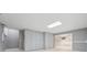 Finished basement with tile flooring, custom storage, and ample space at 2645 Preston Ridge Ln, Dacula, GA 30019
