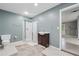 Modern bathroom features a glass shower, wooden vanity and patterned tile flooring at 2645 Preston Ridge Ln, Dacula, GA 30019