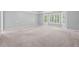 Expansive bedroom bathed in natural light from large bay windows and neutral walls at 2645 Preston Ridge Ln, Dacula, GA 30019