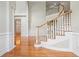 Grand foyer with hardwood floors, curved staircase, and elegant moldings; an open, airy space at 2645 Preston Ridge Ln, Dacula, GA 30019