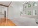 Open-concept living room filled with natural light and featuring hardwood floors at 2645 Preston Ridge Ln, Dacula, GA 30019