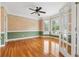 Bright living room with hardwood floors, bay windows, and crown molding; light and spacious at 2645 Preston Ridge Ln, Dacula, GA 30019