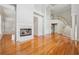Spacious living room with fireplace, hardwood floors, and staircase; an open floor plan at 2645 Preston Ridge Ln, Dacula, GA 30019