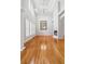 Bright living room with hardwood floors, fireplace, chandelier and two-story windows and ceiling at 2645 Preston Ridge Ln, Dacula, GA 30019