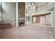 Elegant living room with stone fireplace and staircase to the second floor at 2645 Preston Ridge Ln, Dacula, GA 30019