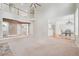 Bright living area with staircase, hardwood floors, and dining area access at 2645 Preston Ridge Ln, Dacula, GA 30019