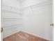 Small walk-in closet featuring wire shelving and neutral carpet at 2645 Preston Ridge Ln, Dacula, GA 30019