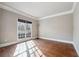 Cozy bedroom with hardwood floors, large window, and plenty of natural light at 2656 Old Norcross Rd, Tucker, GA 30084