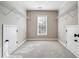 Spacious closet with wire shelving, carpeted floors, and bright light from the window at 2656 Old Norcross Rd, Tucker, GA 30084