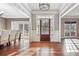 Welcoming entryway with hardwood floors, elegant lighting, and neutral paint at 2656 Old Norcross Rd, Tucker, GA 30084