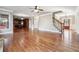 Spacious open-concept living room with hardwood floors, staircase, and view of the kitchen at 2656 Old Norcross Rd, Tucker, GA 30084