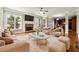 Bright and airy living room with fireplace, plush seating, and hardwood floors at 2656 Old Norcross Rd, Tucker, GA 30084