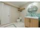 Bathroom featuring a modern vanity, stylish backsplash, and tile flooring detail at 2663 Marcia Dr, Lawrenceville, GA 30044