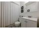 Clean bathroom with a bright vanity and a shower featuring a white curtain at 2663 Marcia Dr, Lawrenceville, GA 30044
