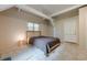 Bedroom with exposed beams, cozy carpet, and natural light creating a relaxing atmosphere at 2663 Marcia Dr, Lawrenceville, GA 30044
